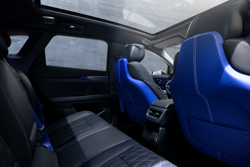 Back Seat View of the 2026 OPTIQ-V Blue Front Seats, Sun Roof, and Interior | Sudbay Cadillac in Gloucester MA